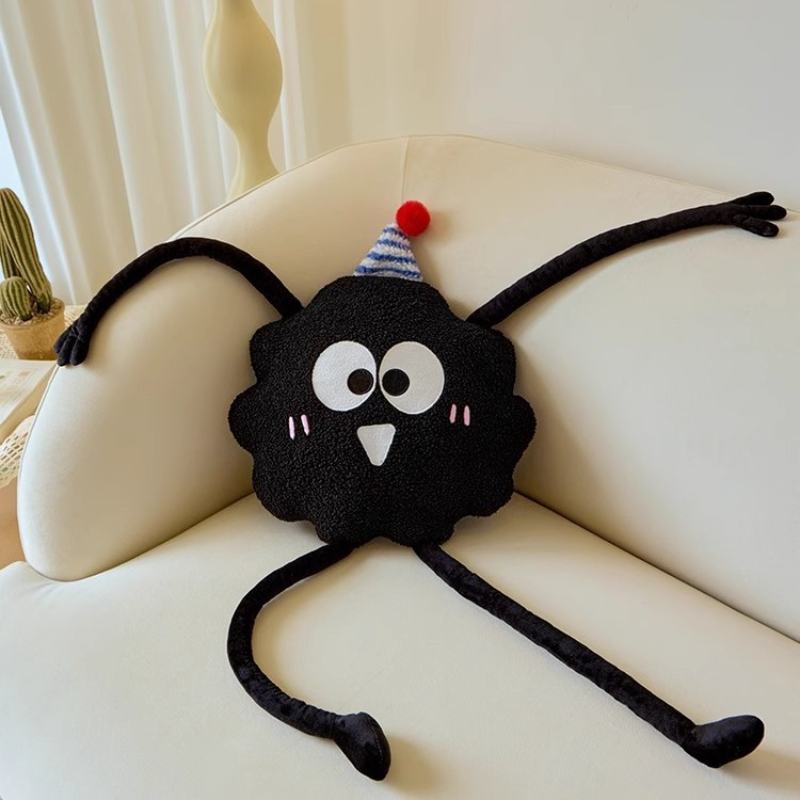 High-ROI quirky long arm monster pillow resting on a sofa, optimized for retail home decor distributors.