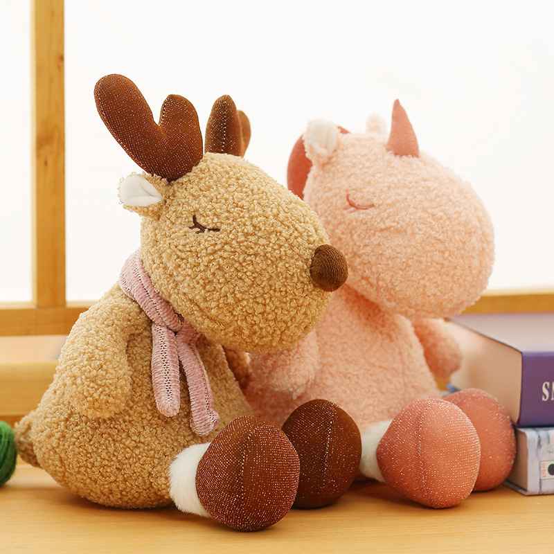 High-ROI reindeer and unicorn plushies with sleepy eyes sitting side by side, perfect for luxury boutique supply.