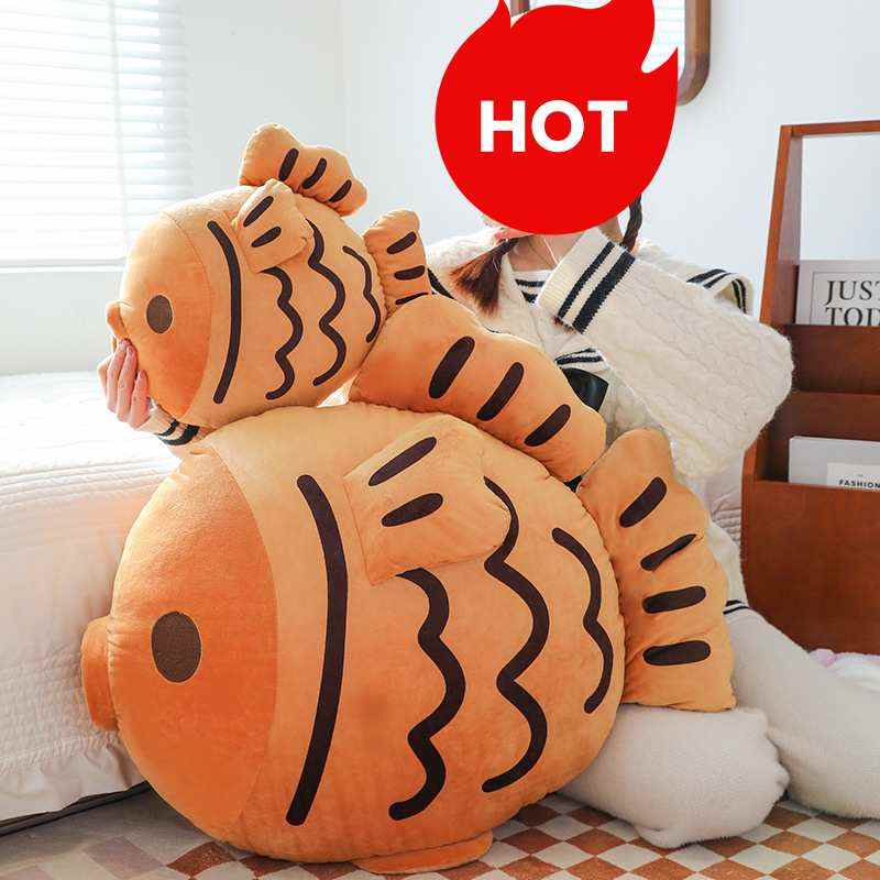High-ROI taiyaki fish plush pillows in two sizes held by model, optimized for retail distributors.