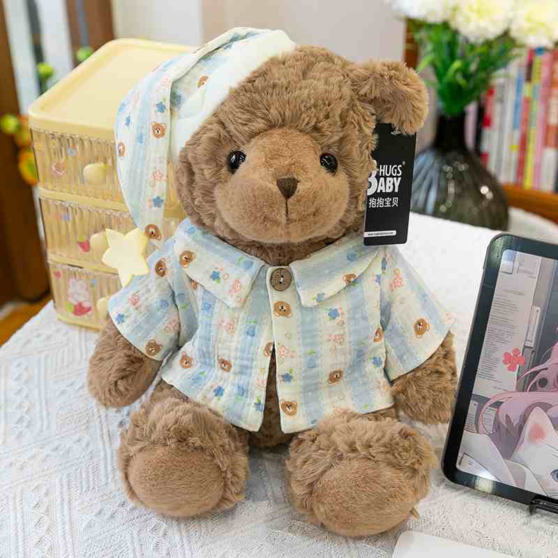 Kawaii pajama teddy bear gift shop supply showcasing a dark brown plush bear by a tablet, optimized for B2B custom sourcing.