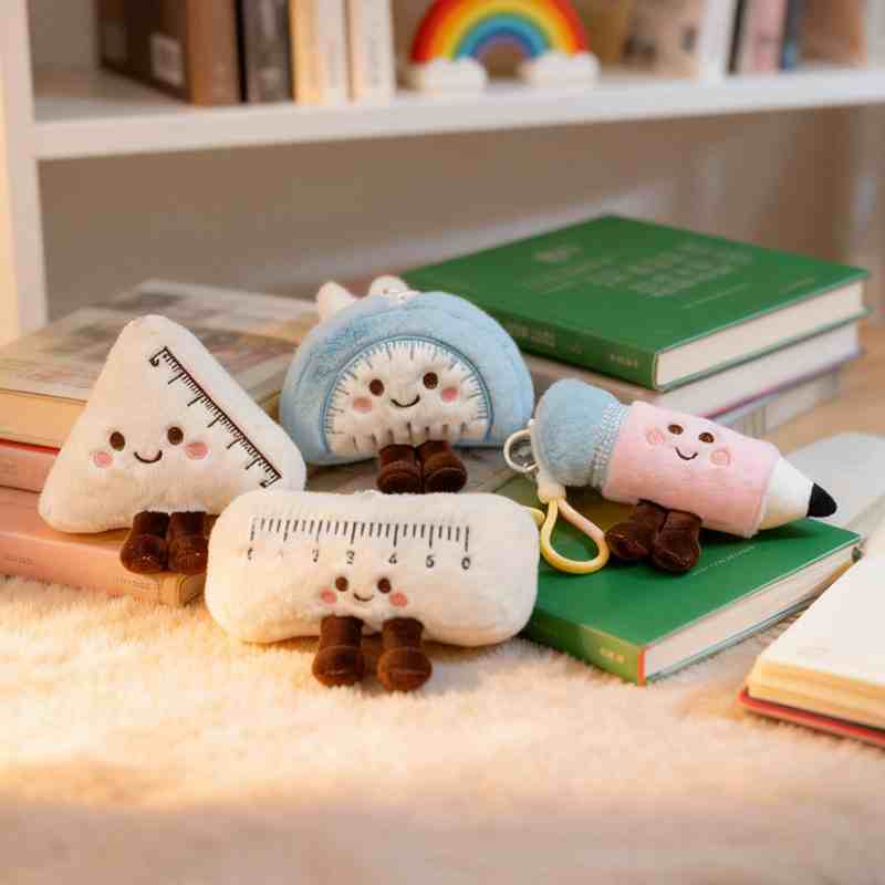 Novelty stationery stuffed animals sitting on books, ideal for gift shops and bookstore retail displays.