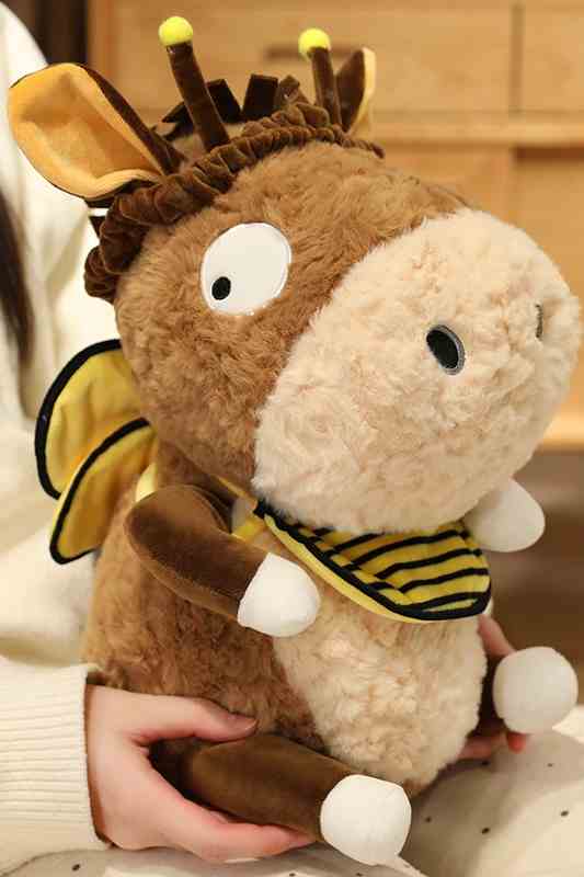 Person holding little donkey plushie showing size reference for global B2B buyers