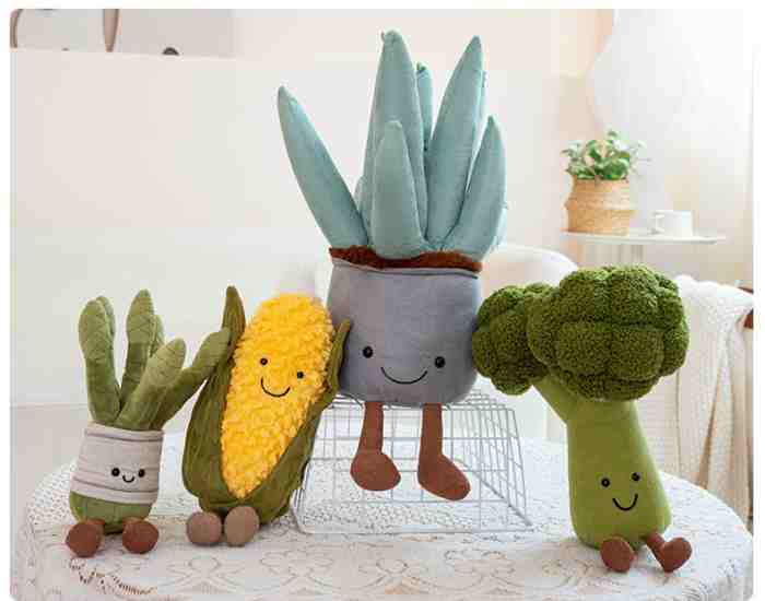 Factory-direct Kawaii veggie plush mix with dangling legs on display for redemption counters