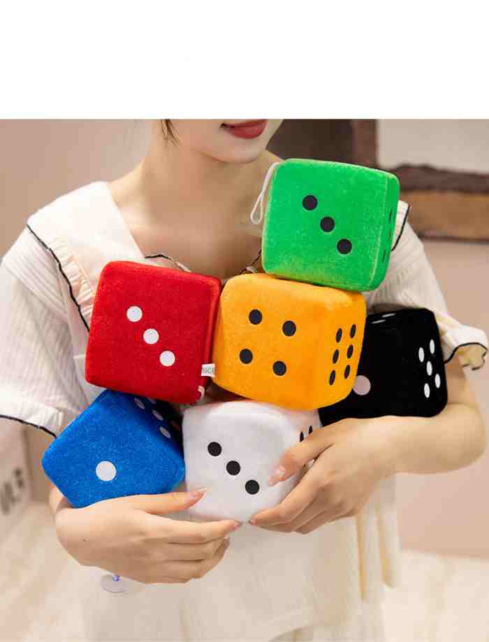 Close-up of durable stitching on a plush dice toy, showing premium quality for wholesale buyers.