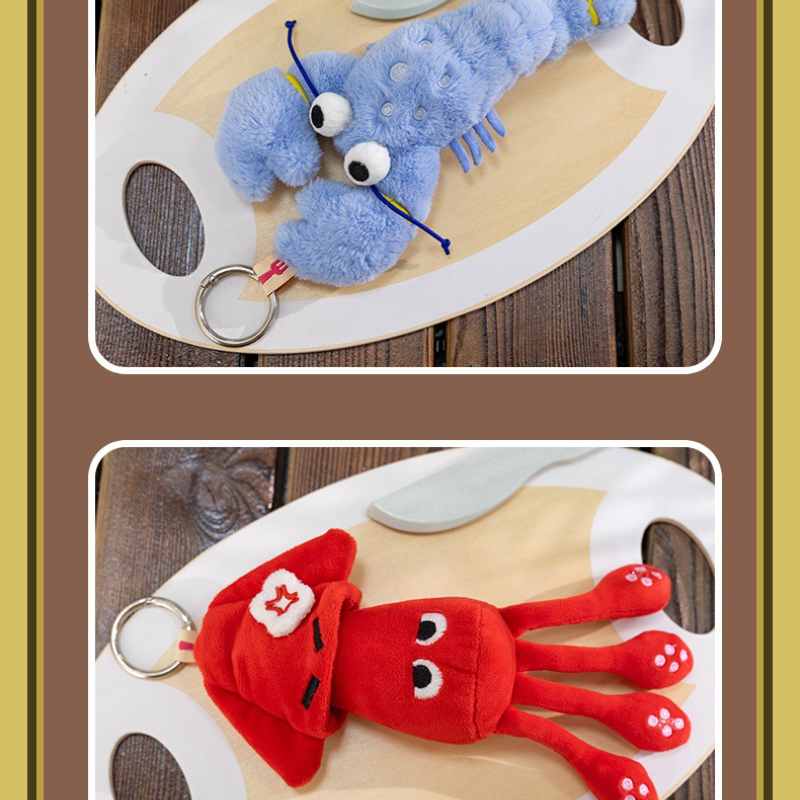 Premium blue lobster and red angry squid plush pendants on a tray, ideal for boutique vendor sourcing.