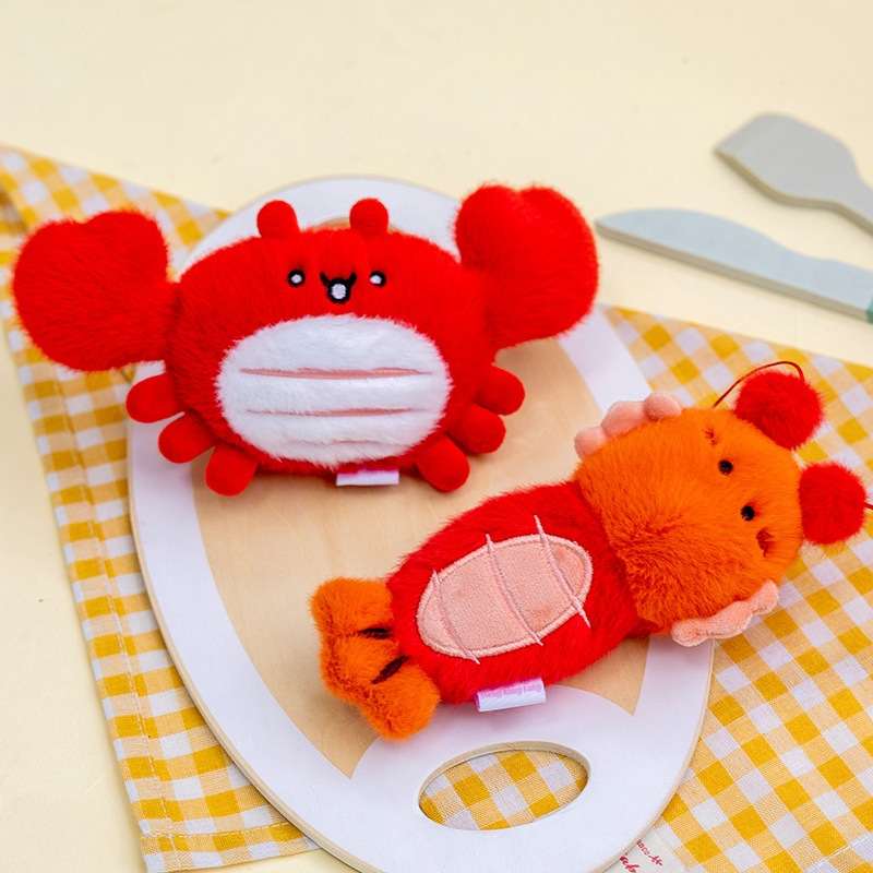 Premium boutique red crab and orange lobster plush pendants for wholesale gift shop distributors.