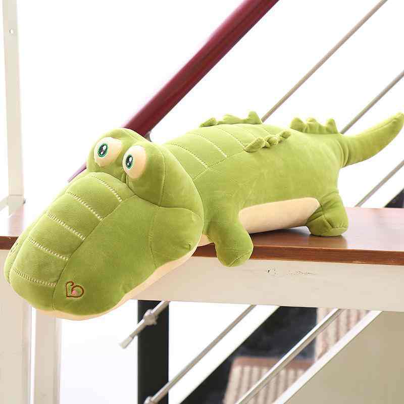 Premium boutique crocodile soft toy lounging on stairs, ideal for nursery decor wholesale distributors.