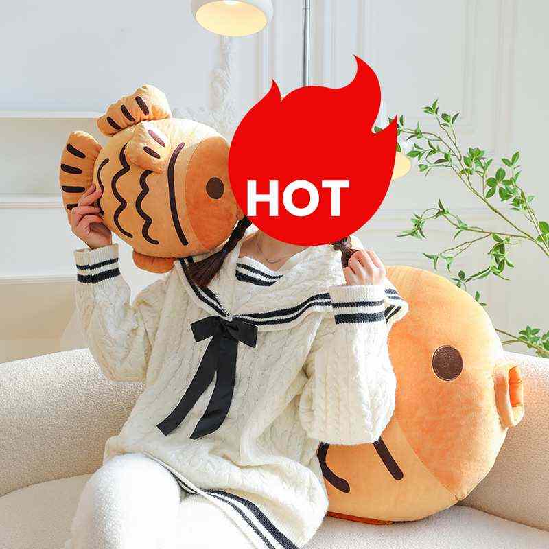 Premium boutique giant taiyaki stuffed toy cushion on sofa for global wholesale buyers.