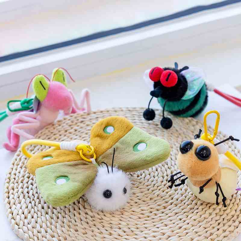 Premium butterfly and bee plush charms with big eyes, designed for boutique wholesale and bag accessories.