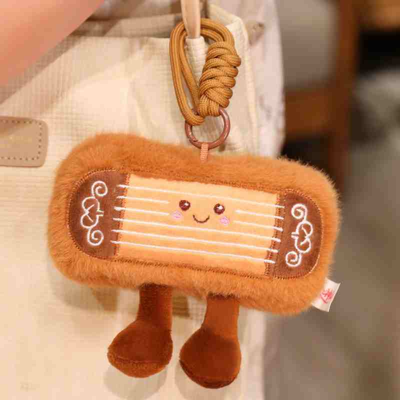 Premium Guzheng plush bag pendant and keychain, a popular mini claw machine prize.