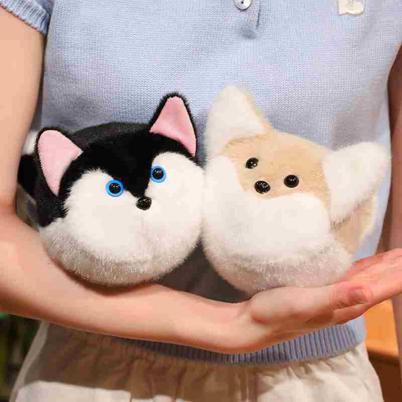 Premium husky dog and fox plush balls held in hands to demonstrate the ultra-soft fluffy texture, tailored for boutique supply.