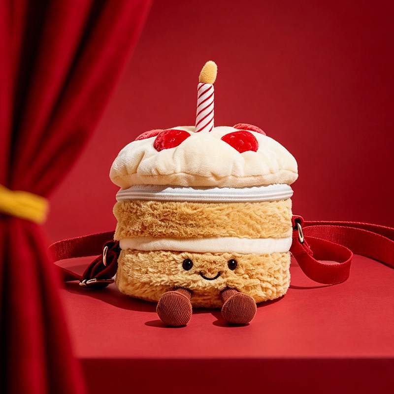 Premium plush birthday cake shoulder bag featuring a striped candle and strawberries for boutique suppliers.