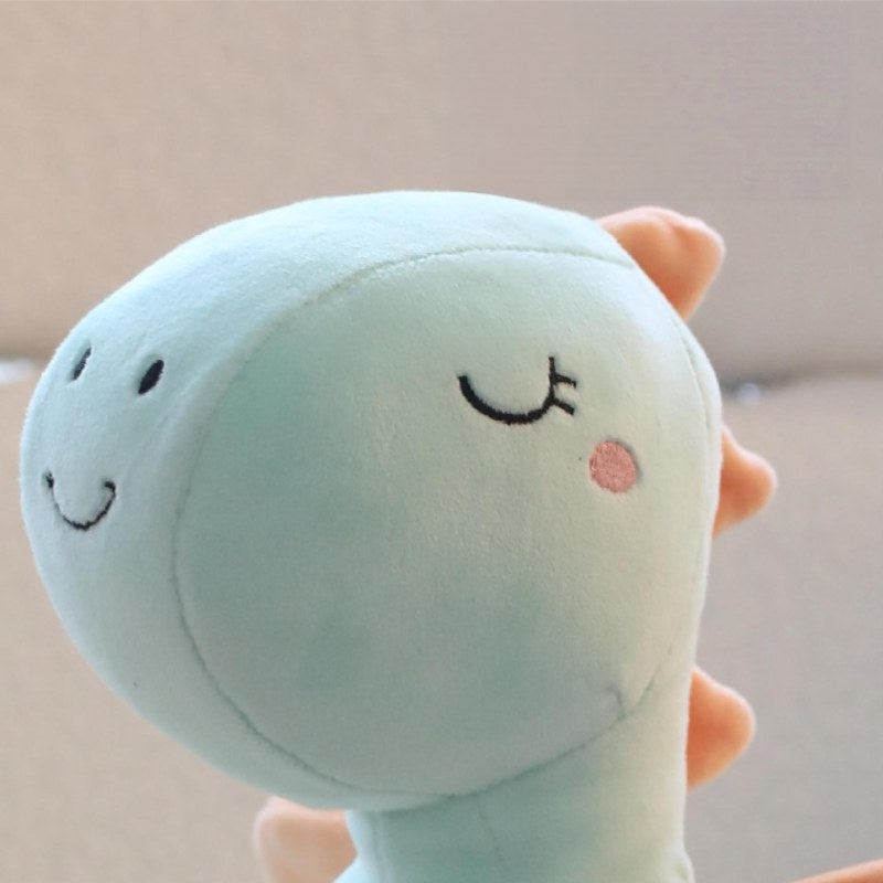 Premium plush dragon embroidery details showing closed sleeping eyes for global B2B toy sourcing.