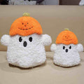 Premium spooky cute pumpkin ghost plushies displayed side by side on a cozy surface, tailored for boutique retail supply.