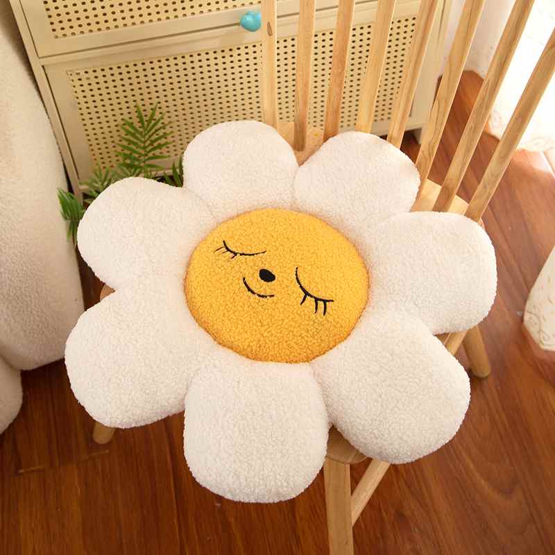 Premium white daisy smiley seating pad cushion displayed on a wooden chair for boutique supply.