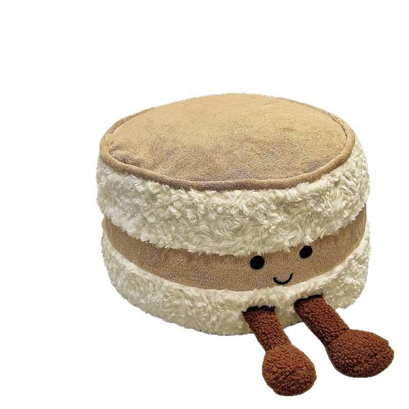 Private label biscuit stuffed cushion on a white background for custom OEM plush manufacturer.