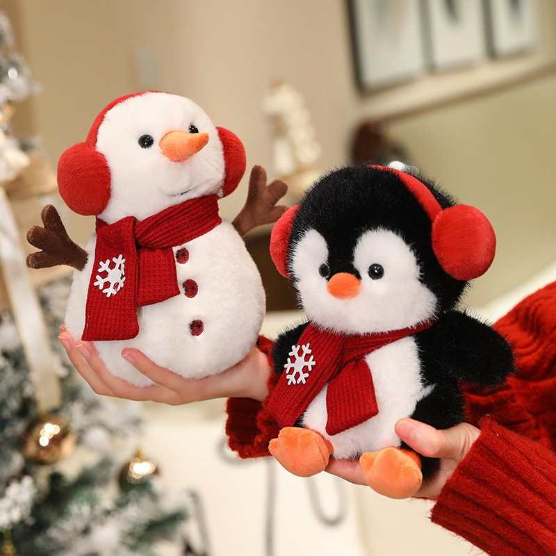 Ready stock mini snowman and penguin plushie held in hands, available from B2B wholesale distributor.