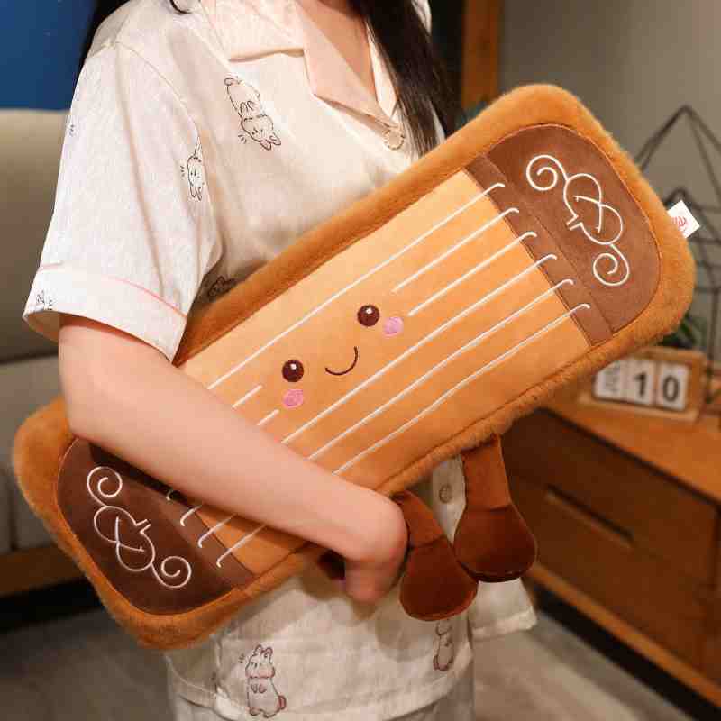 Soft novelty instrument plush toy held by model, ideal as a high-ticket crane game prize.