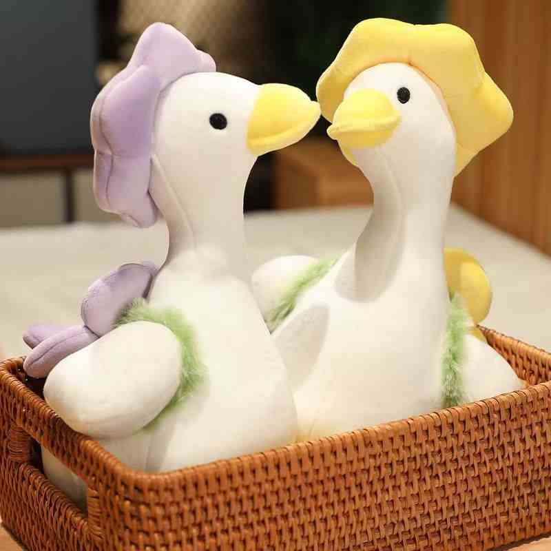 Trending nursery decor goose plushie with a sun yellow flower hat, perfect for low MOQ mixed-carton bulk wholesale ordering.