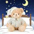 Wholesale bedtime pajama teddy bear plush sitting on a cozy bed with stars and moon background, perfect for nursery decor B2B sourcing.