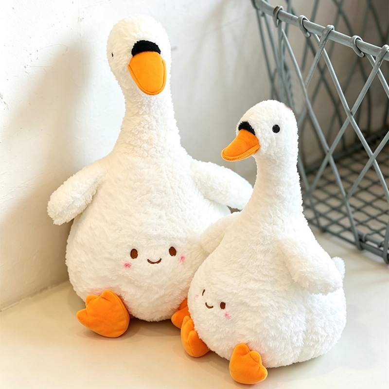 Wholesale chubby white goose plush toys in two sizes for B2B nursery decor sourcing.