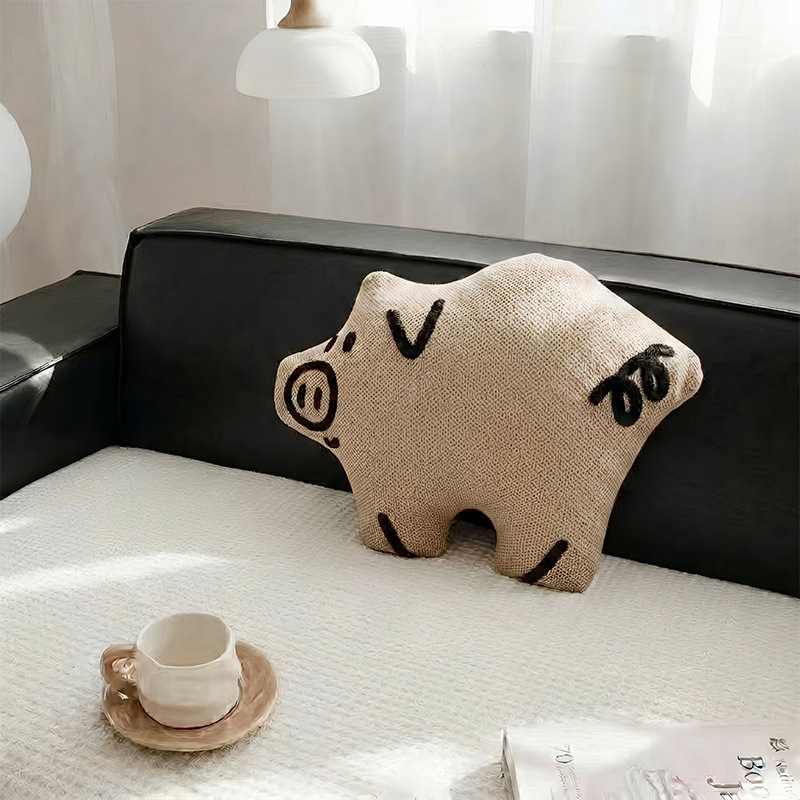 Wholesale cute minimalist pig plush pillow on a couch for B2B home decor sourcing.