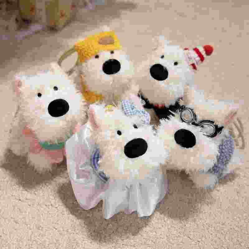 Wholesale cute white terrier plush bag charm assortment featuring various outfits, perfect for boutique checkout displays.