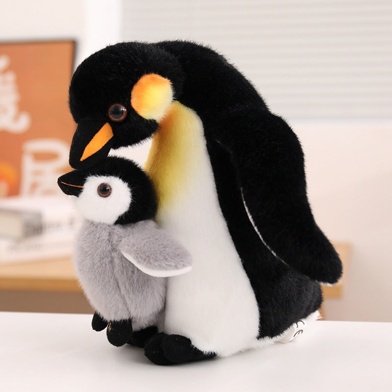 Wholesale Emperor Penguin family plush toy in classic black, yellow, and white colorways, perfect for custom aquarium souvenir sourcing.