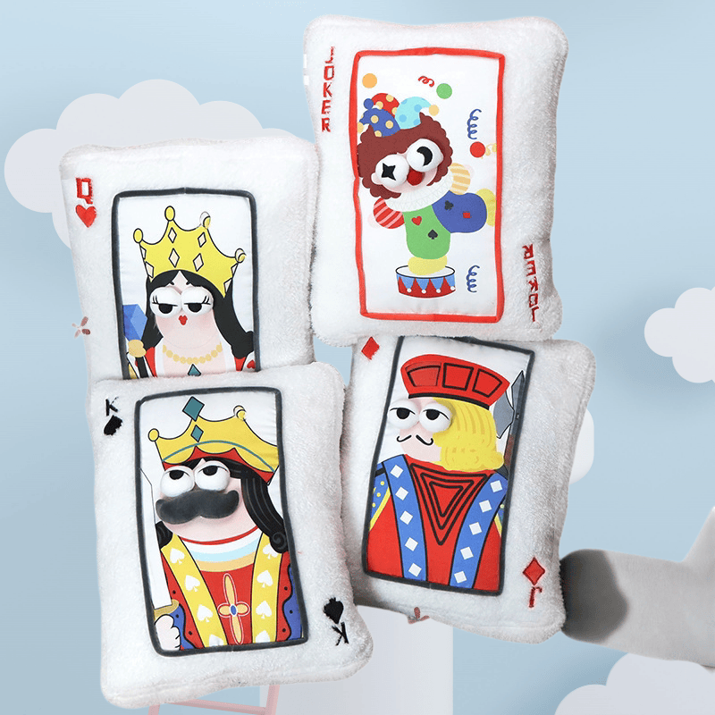 Wholesale funny playing card plush pillows stacked together, a striking visual merchandising display for party and carnival retailers.
