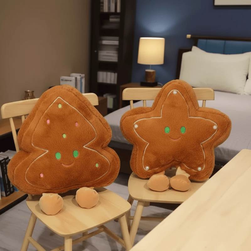 Wholesale gingerbread star and tree plush pillow assortment displayed on chairs for B2B holiday sourcing.