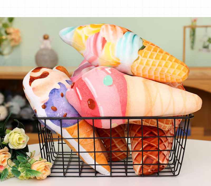 Wholesale ice cream cone plush toys displayed in a black wire basket, ideal for retail store visual merchandising.