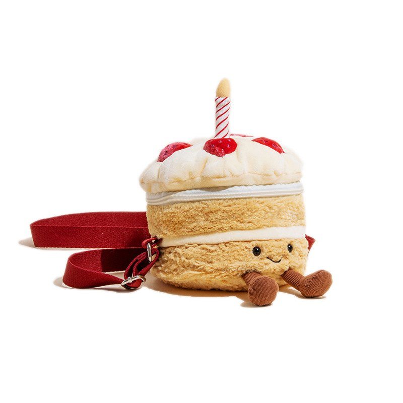 Wholesale kawaii birthday cake plush crossbody bag with red strap and dangling legs for B2B sourcing.