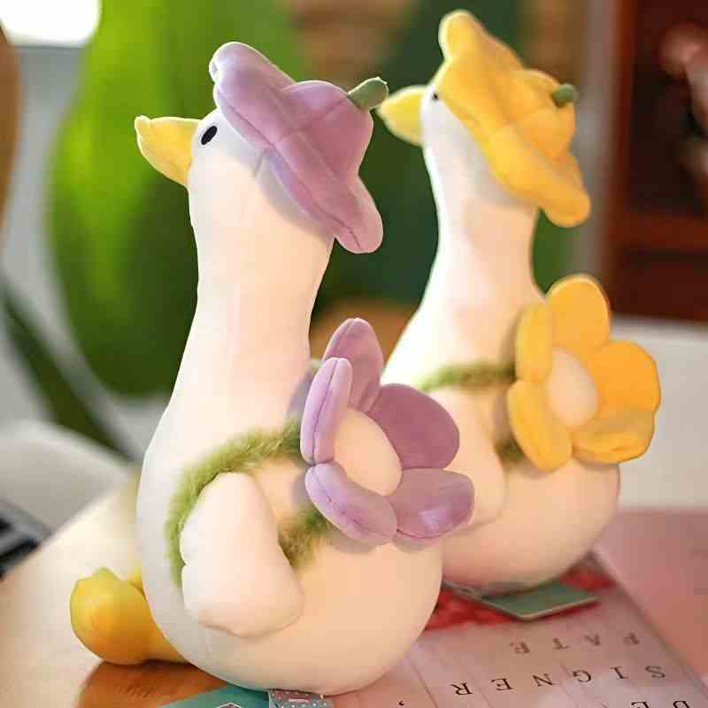 Wholesale kawaii flower hat goose plush display featuring two geese in a woven basket, ideal for spring visual merchandising.