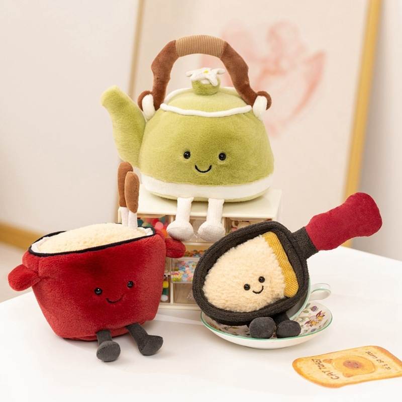 Wholesale kawaii kitchen food plush toy assortment including a green teapot, red noodle bowl, and frying pan for global B2B retailers.