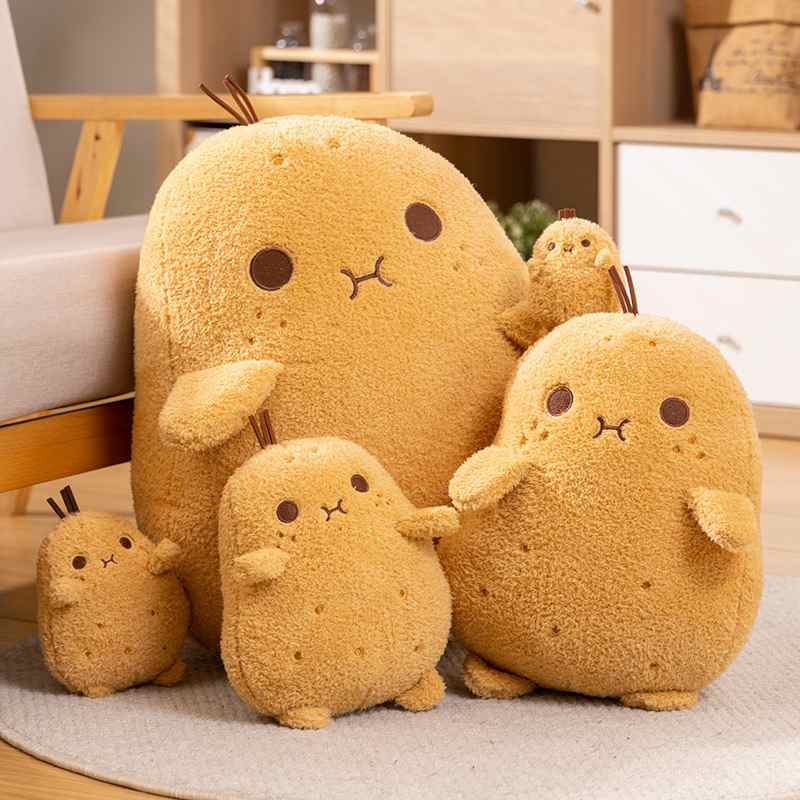 Wholesale kawaii potato plush family assortment displaying five different sizes on a rug, perfect for high-visibility store displays.