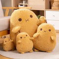 Wholesale kawaii potato plush family assortment displaying five different sizes on a rug, perfect for high-visibility store displays.