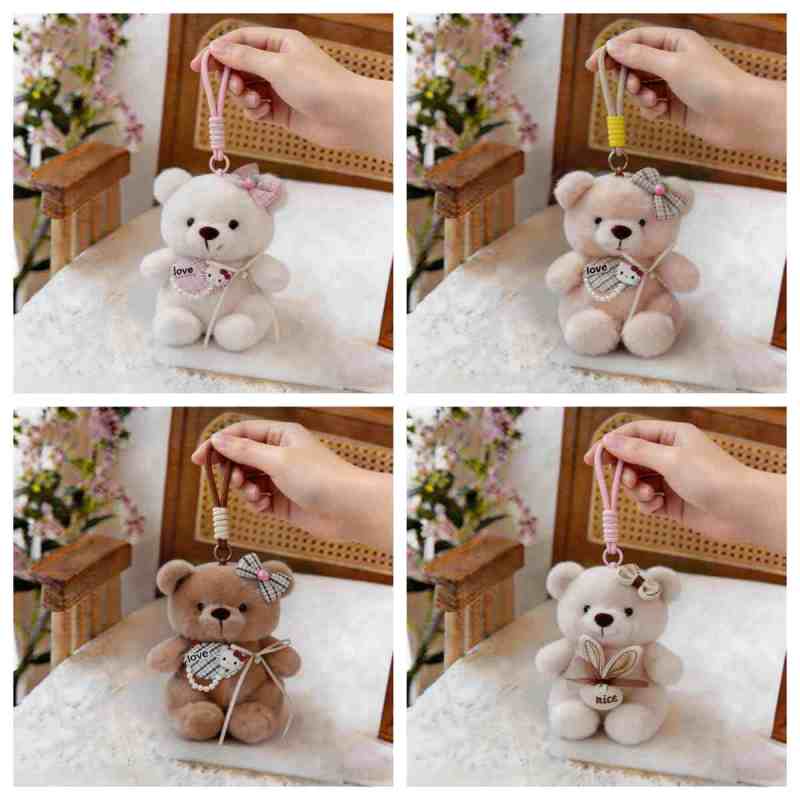 Wholesale kawaii teddy bear keychain assortment featuring white, beige, and brown plush bears with embroidered love pouches for B2B sourcing.
