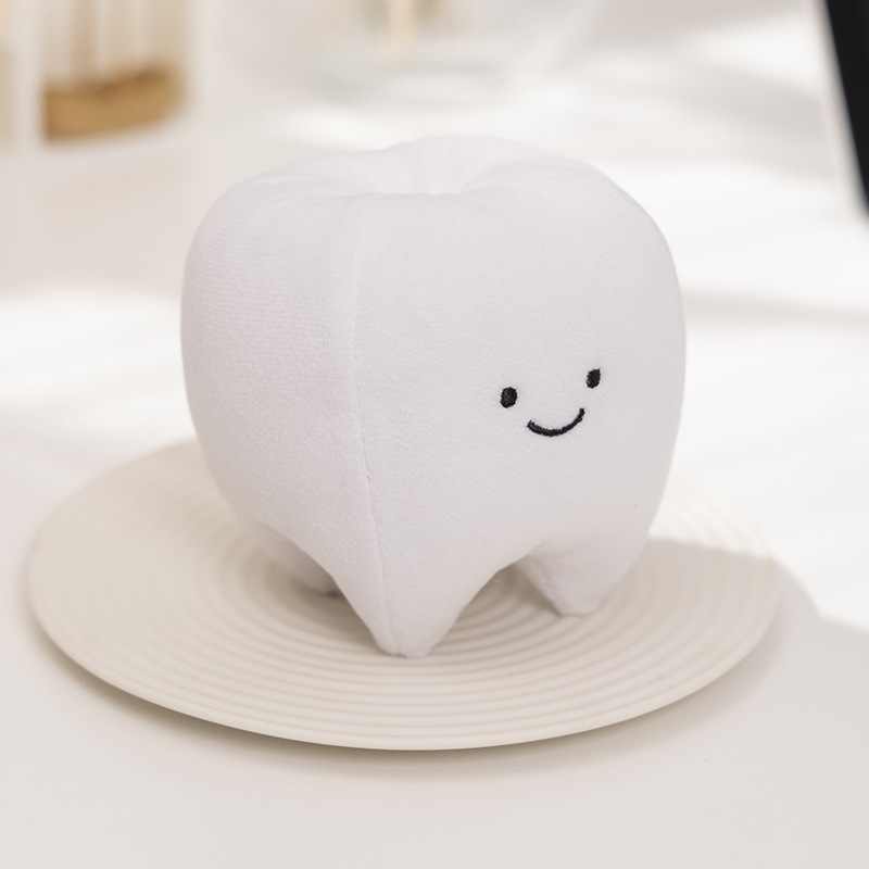 Wholesale kawaii white tooth plush toy, a perfect promotional gift for pediatric dentist clinics and healthcare retailers.