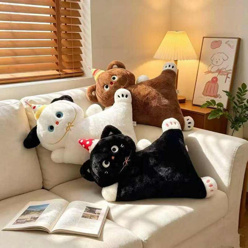 Wholesale lying animal plush party pillow assortment featuring white dog, brown bear, and black cat on a sofa for B2B sourcing.