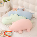 Wholesale pastel animal long hugging pillow plush collection featuring a blue hippo, green crocodile, and pink pig, ideal for home decor and gift shop retail.