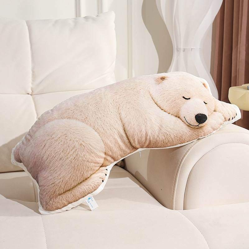 Wholesale plush polar bear body pillow resting on a white sofa for B2B home decor sourcing.