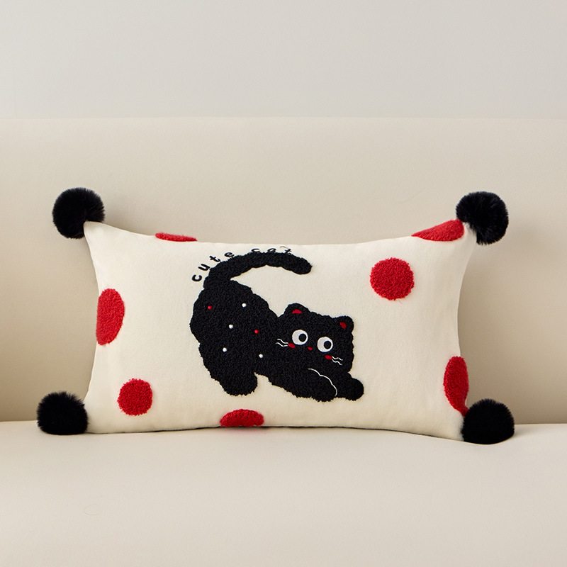 Wholesale polka dot black cat tufted lumbar cushion with black pom-poms for B2B home decor.