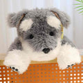 Wholesale realistic Schnauzer dog plush toy close-up on wooden shelf for B2B sourcing.
