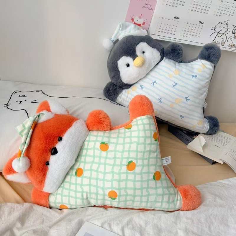 Wholesale sleeping fox and penguin plush backrest pillows on a bed for B2B home decor sourcing