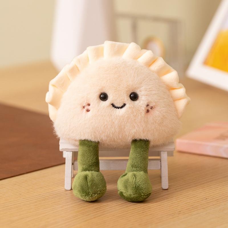 Wholesale smiling stuffed dumpling food plushie with legs sitting on a mini chair from China factory manufacturer.