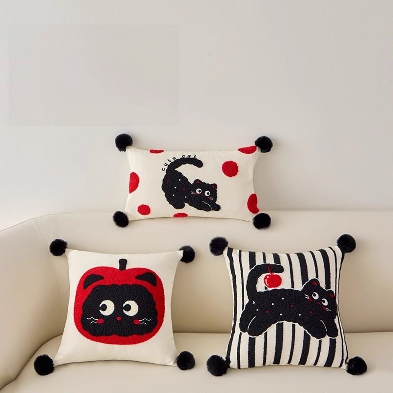 Wholesale tufted cat decorative pillow assortment including striped and apple designs for retail.